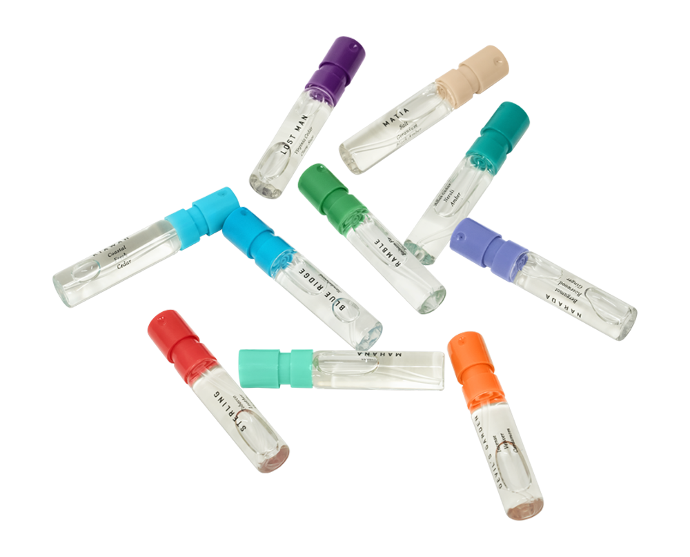 Multiple loose fragrance vials laying flat