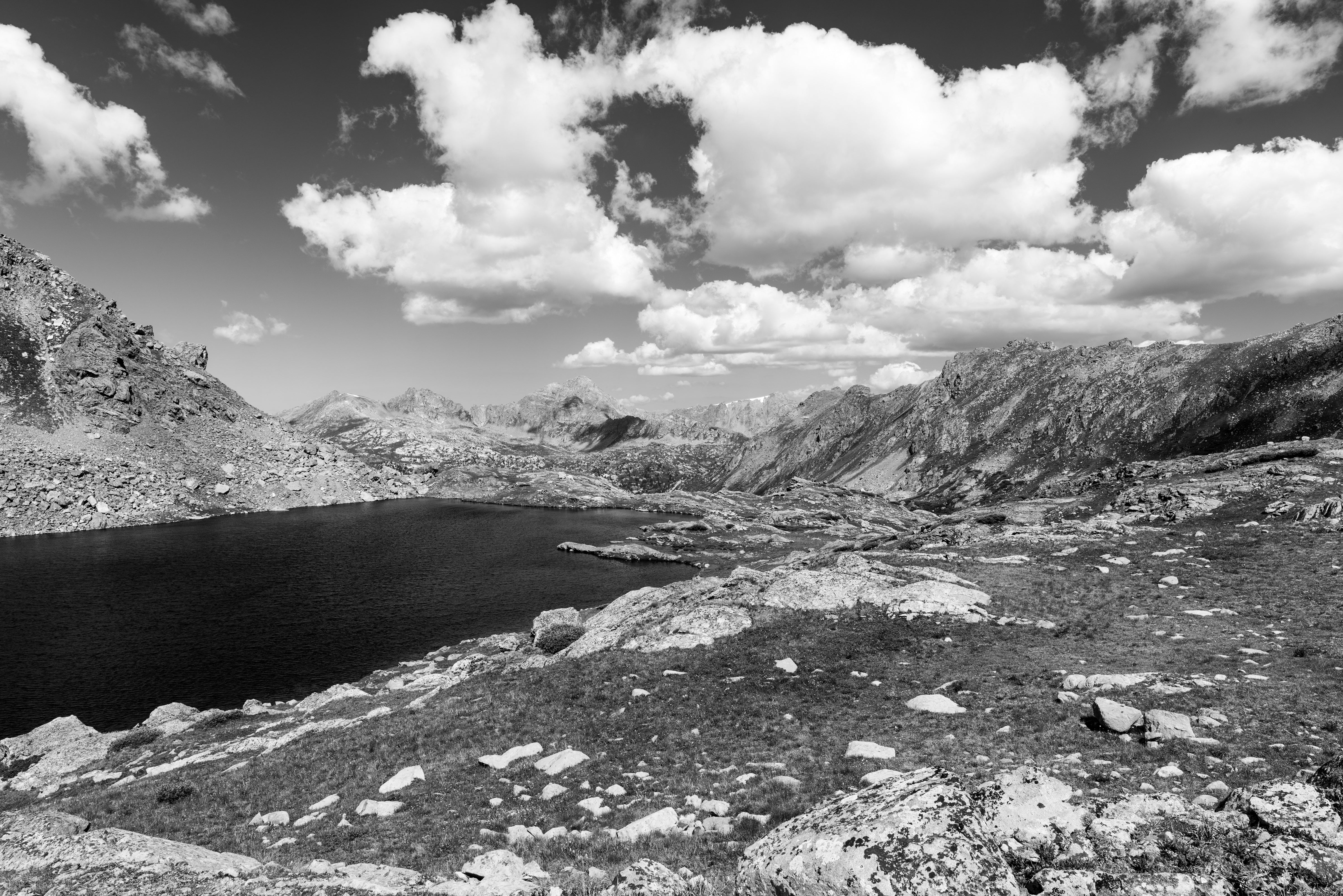 image of mountain lake and mountains and sky, black and white