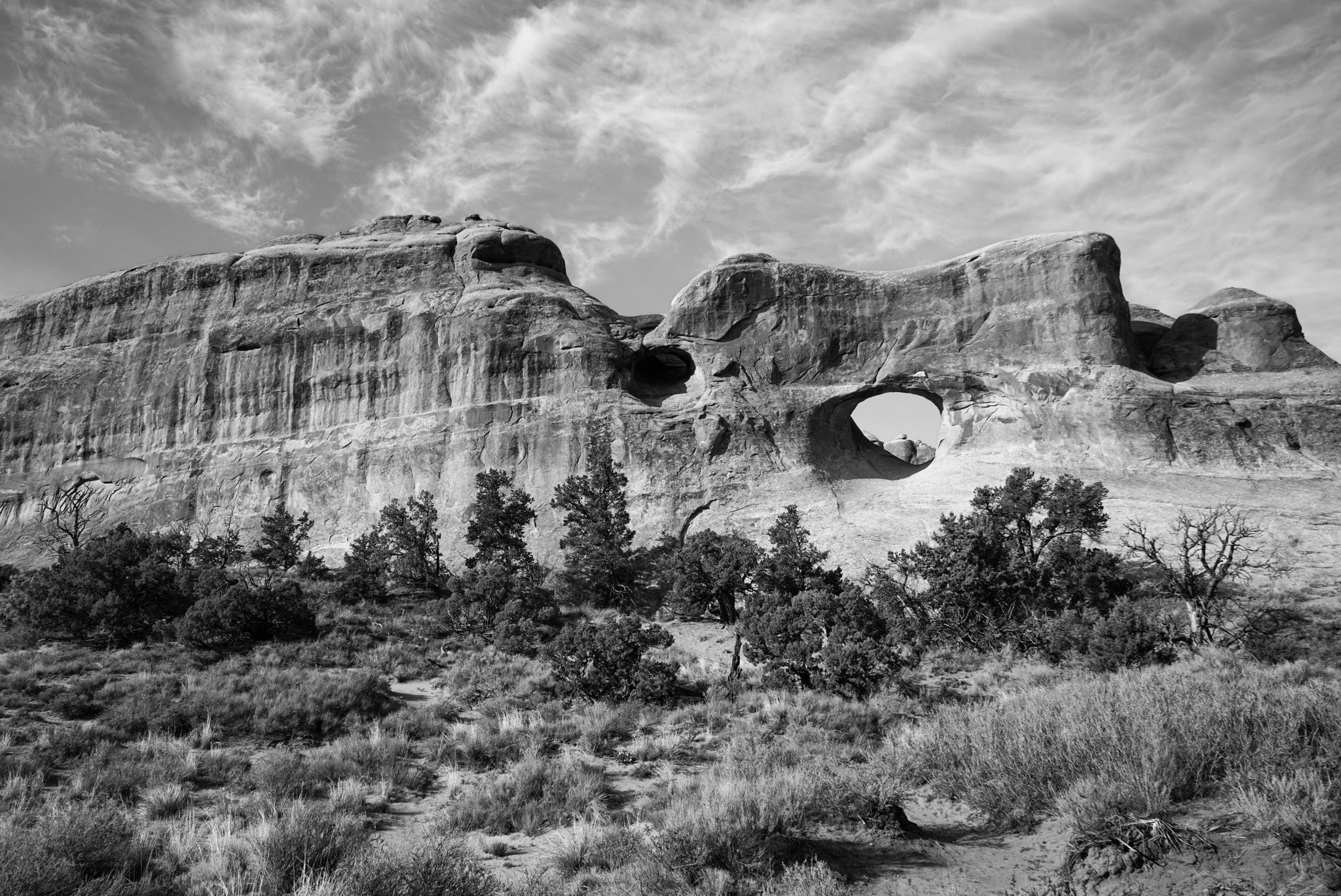 black and white image of desert rock formation